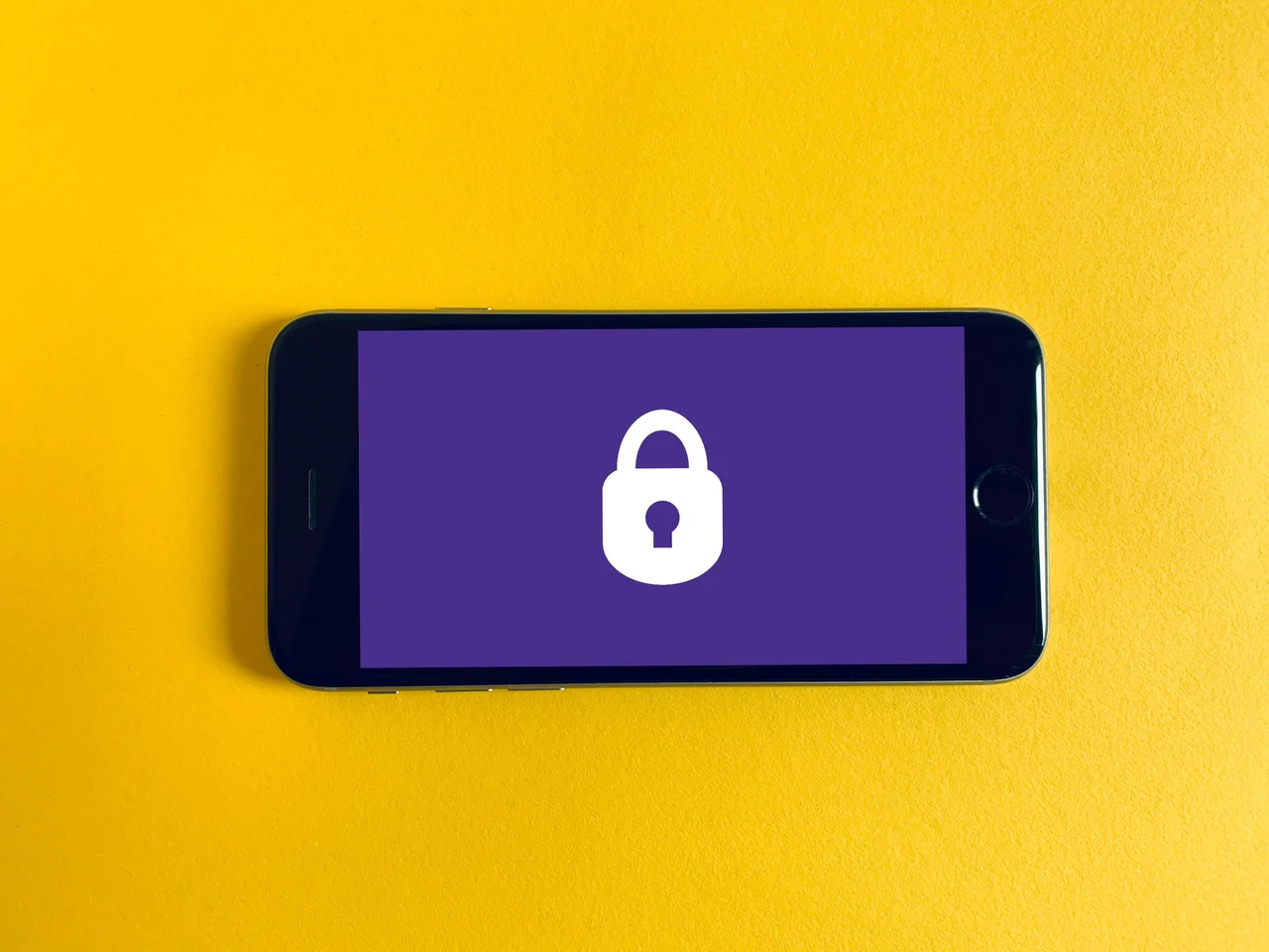 Phone showing an image of a lock (orange background)