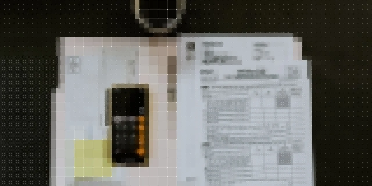Image of a calculator and documents