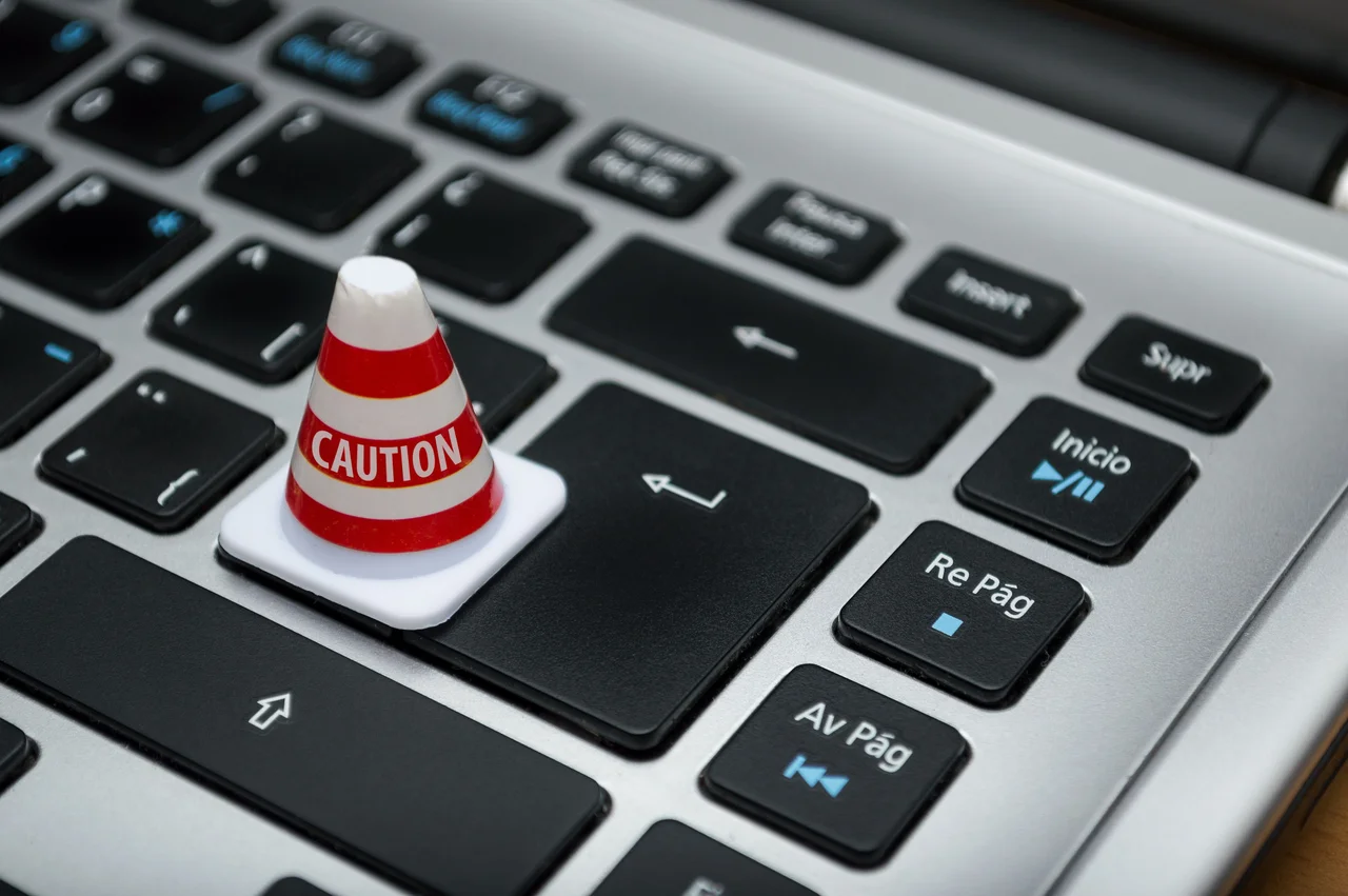 Keyboard with a caution sign on top