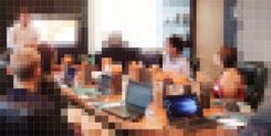 Pixellated image of people in an office