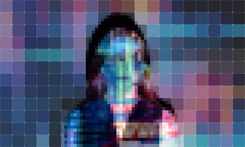 Pixellated image of a person with a projection of a code
